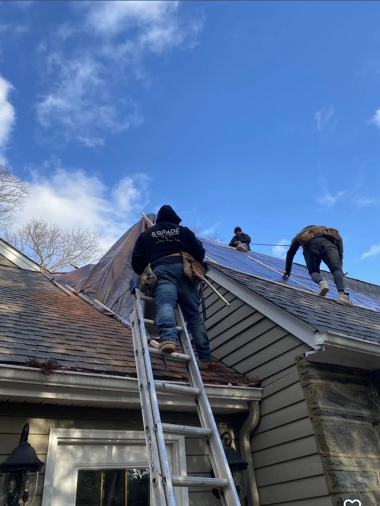 A GRADE crew working on a damaged roof